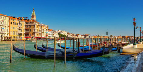 Obraz premium Venetian gondolas moored in Grand Canal