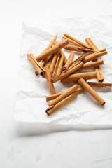 Cinnamon condiment on white background