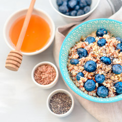 buckwheat porridge with fruits and honey, chia seeds, flax seeds, the concept of a healthy breakfast, diet, veganism, vitamins
