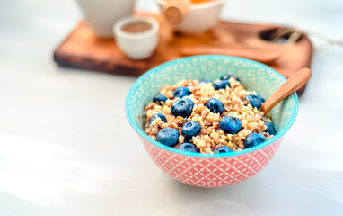 buckwheat porridge with fruits and honey, chia seeds, flax seeds, the concept of a healthy breakfast, diet, veganism, vitamins