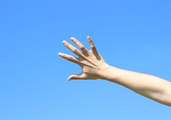 Woman hand isolated on clear sky background