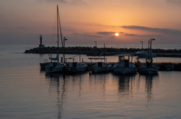Fototapeta na wymiar Sunrise over Cala Bona Marina in Majorca, peaceful and calm start to the day.