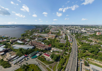 Summer city and road with cars, a lot of trees, aerial view. Industrial Zone and pond. Ekaterinburg, Verkh-Isetsky district, Russia