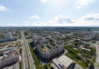 Summer city and road with cars, aerial view. Ekaterinburg, Verkh-Isetsky district, Russia