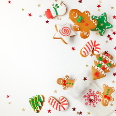 Christmas holiday background with gingerbread cookies flying in motion. Winter or Christmas festive concept. Flat lay, copy space.