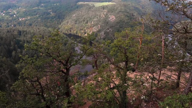 Aerial view of incredible Vyhl&iacute;dka M&aacute;j. Calm, relaxing, horseshoe river meander. 
Reveal shot of trees, pullback shot 