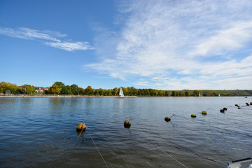 yachts making a close turn near buoy on a summer river.