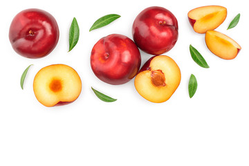 fresh red plum and half with leaves isolated on white background with copy space for your text. Top view. Flat lay