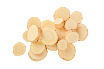 Parsnip root slices isolated on white background closeup. Top view. Flat lay