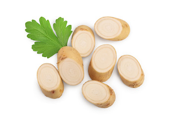 Horseradish root slices and parsley isolated on white background, Top view. Flat lay.