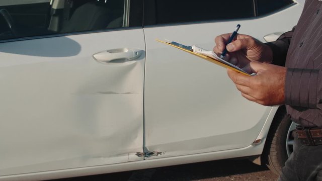 insurance agent report car damage