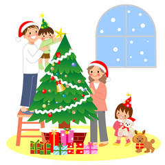 Obraz na płótnie Canvas クリスマスツリーの飾り付けをする親子