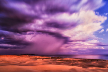 Fototapeta na wymiar Dunes Blurred Clouds Sea Anna