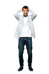 Fototapeta premium Full-length shot of Handsome man with beard frustrated and takes hands on head over isolated white background