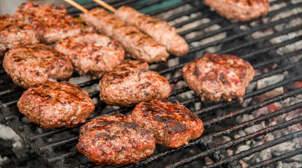 Juicy Beef Hamburgers Cooking On A Barbecue