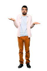 Full-length shot of Handsome man with beard unhappy for not understand something over isolated white background