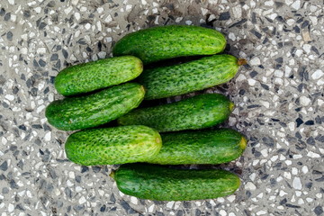 A stack of several fresh green cucumber gherkins on the mosaic, Sofia, Bulgaria   