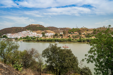 Fototapeta na wymiar Sanlucar de Guadiana in Spain pictured from portuguese side on the opposite side of Guadiana river