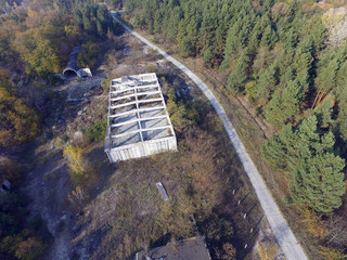 Fototapeta premium Drone quadrocopter explores an abandoned totally marauded and vandalised Soviet military base. Near Chernobyl Area. 