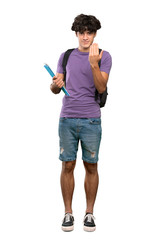 A full-length shot of a Young student man inviting to come with hand. Happy that you came over isolated white background