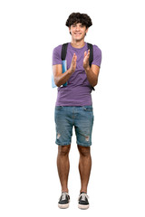 A full-length shot of a Young student man applauding after presentation in a conference over isolated white background