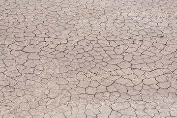 Top view of Dry land in the construction area. Cracked ground background