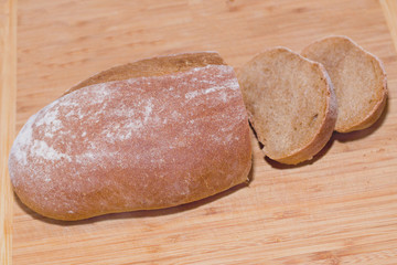 home baked bread on wooden background
