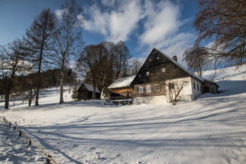 Fototapeta na wymiar cottage in winter land