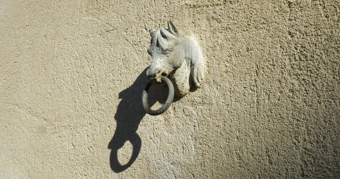 Horse hear attach ring with shadow on wall. old french aged style, in Chateau du lude, in chateaux de la Loire valley. Le lude, France 27/2/19