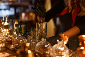 Cropped view of cocktail Preparation. The barman is preparing a drink.