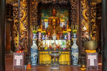 Fototapeta na wymiar Vinh Trang pagoda near My Tho city, which attracts the spiritual culture of the people to visit and worship in Tien Giang, Vietnam