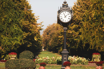 Public clock in Cismigiu Park in downtown Bucharest, Romania, during a sunny autumn day