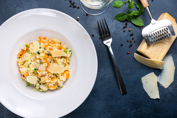 Risotto with carrots and chicken. copy space, modern plated.