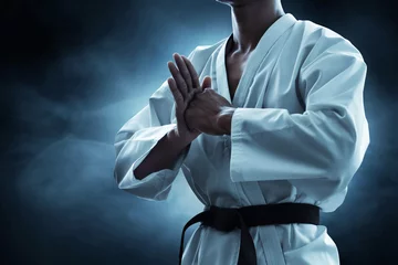  Karate martial arts fighter on dark background © fotokitas