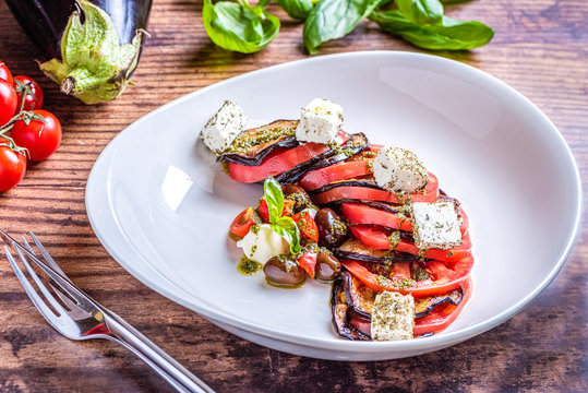 Eggplant salad with tomatoes and feta cheese.