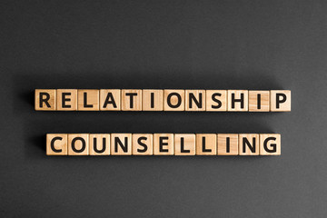 Relationship counselling - word from wooden blocks with letters, relationship counselling and support for couples concept,  top view on grey background