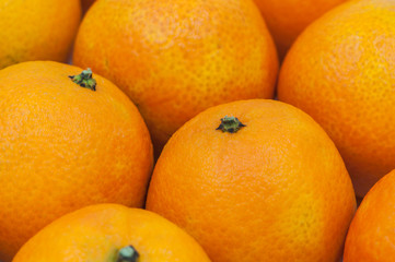 Obraz na płótnie Canvas close up of fresh orange fruits background