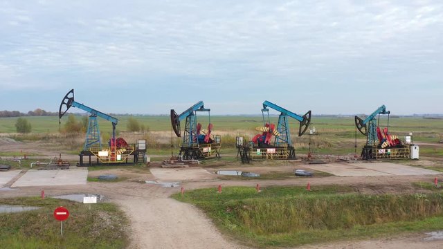 The row of oil derricks on meadow