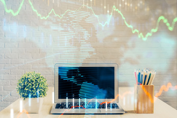 Financial graph colorful drawing and table with computer on background. Double exposure. Concept of international markets.