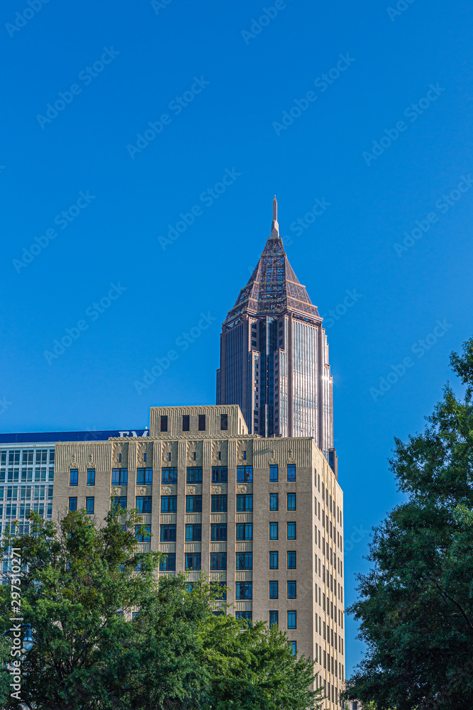 Wall mural Ornate Office Building and Modern Tower Against blue Sky