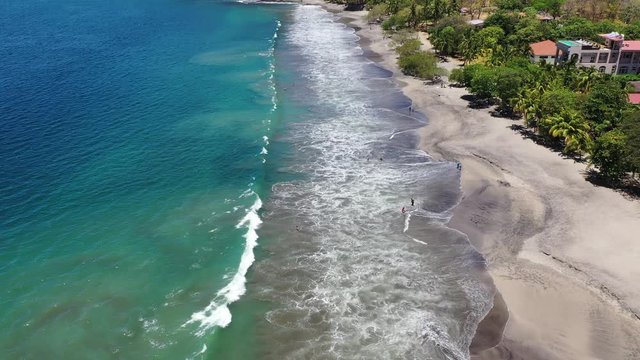 Aerial view of waves crashing on beach in Costa Rica