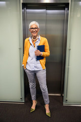 senior business woman office workplace corporate building © Lumos sp