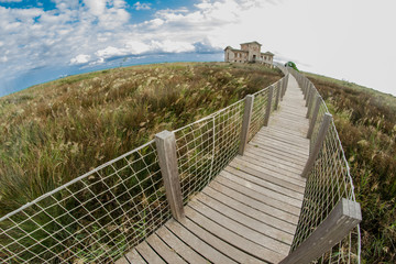 Fototapeta na wymiar Mirador del Semáfor, old military building on the beach of Barcelona