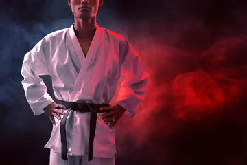 Foto op Aluminium Karate martial arts fighter on dark background © fotokitas