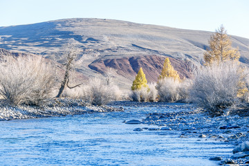 Autumn nature with river and mountains. Autumn background.