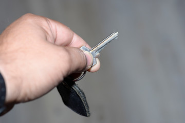 key in hand to open the door