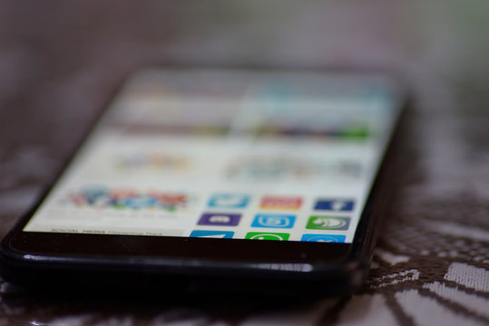 logos social networks in mobile on the table