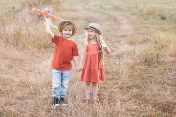 Sweet childhood. Memories of childhood. Valentine day. Kids dreams of becoming a pilot. Human emotions kids first love. The concept of child kindness and childhood.