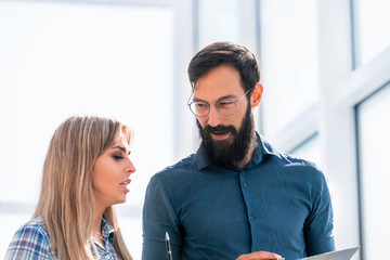 close up. businessman and his assistant discussing the document