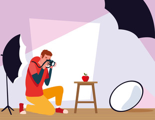 man with camera in photo studio